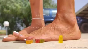 Giantess thought it would be very funny to line up gummy bears next to