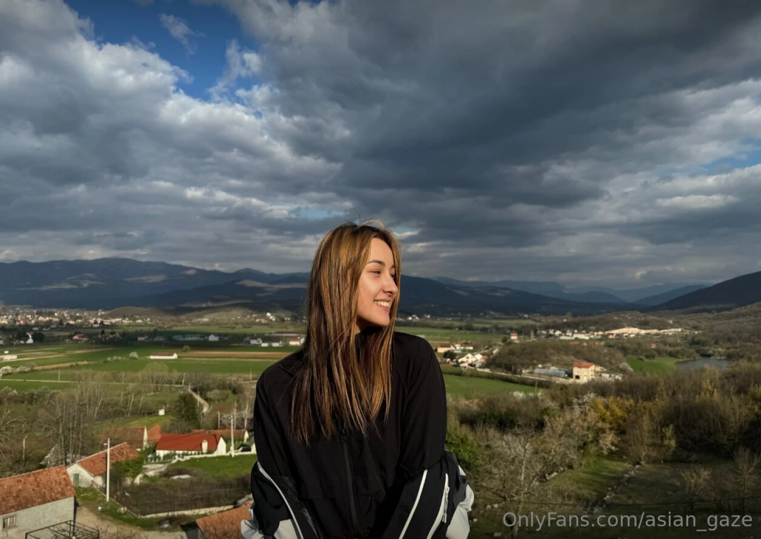 In the distance majestic mountains stood tall their snow-capped peaks 