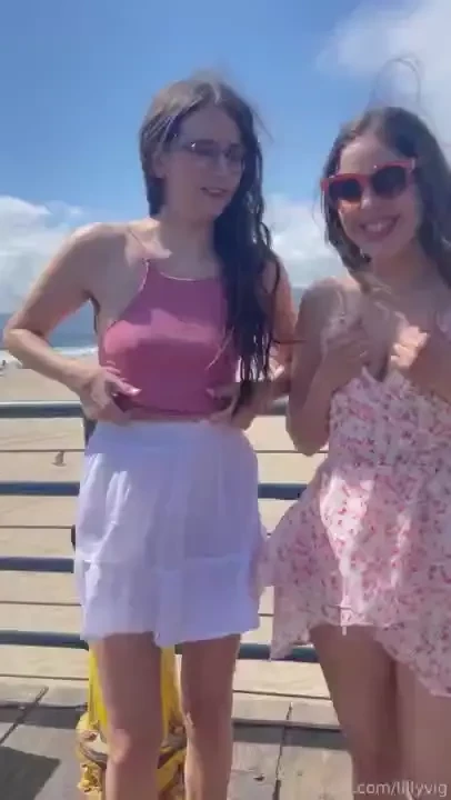 Flashing our titties outside on the pier we are naughty girls with 