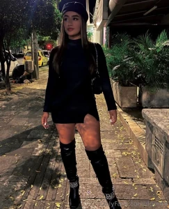 The wind teased her hair the heels clicked against the concrete and