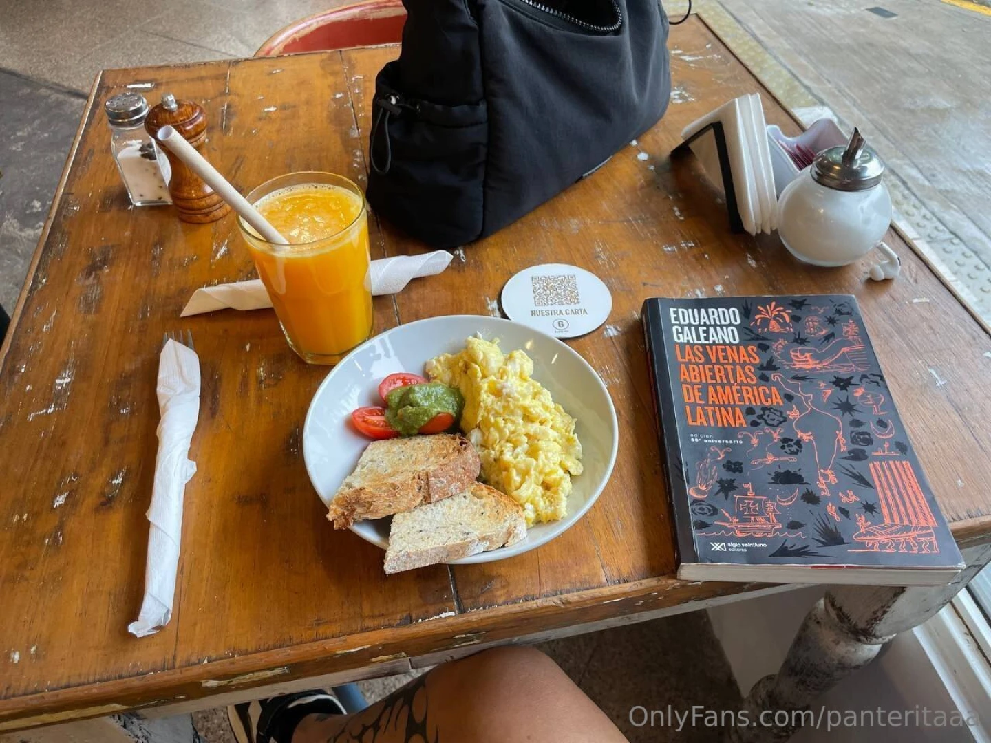 Buenos d as morning at the cafe fresh juice toast with eggs and a book 