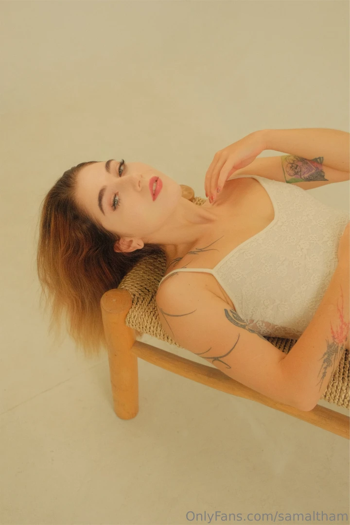 Lying in lacy lingerie hair spread across the chair and my gaze 