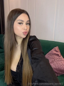 The black robe softly encircles her figure revealing just enough to