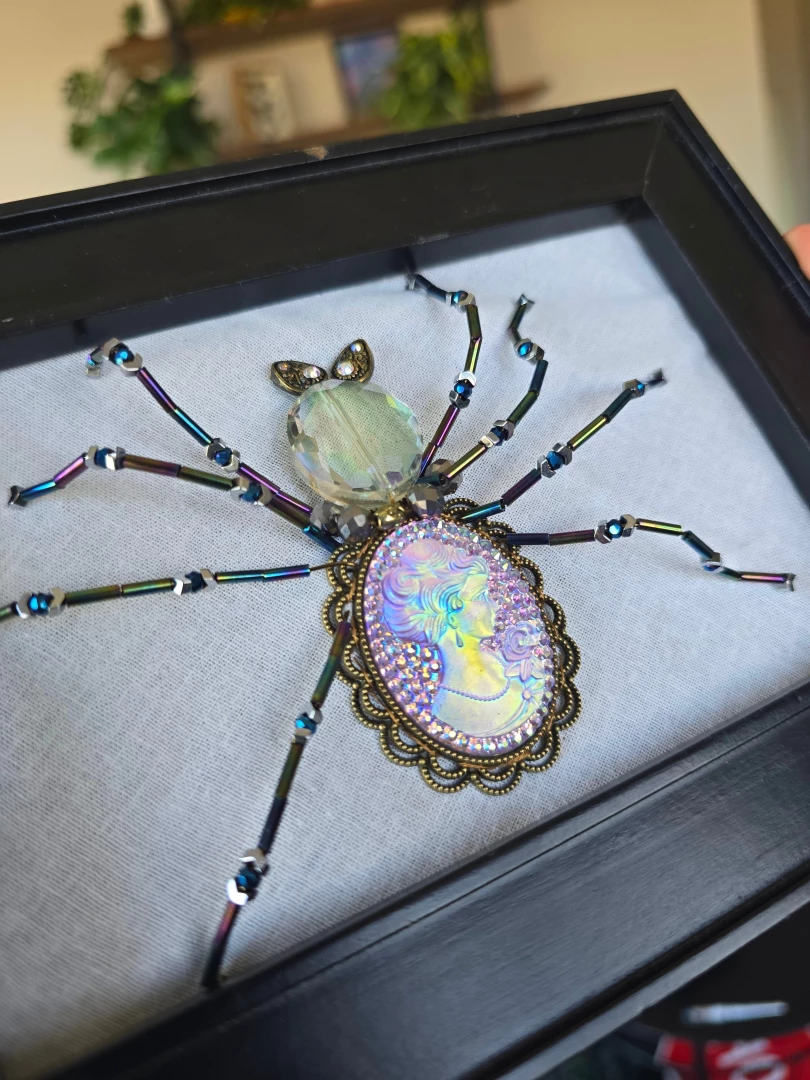 I made a bead embroidered spider go easy on me this is the first time 