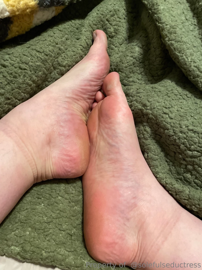 These feet are ready for a massage in bed 