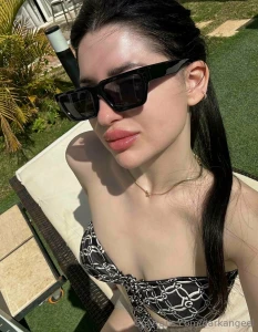 The sun warms up my skin sculpts shadows between my collarbones and i