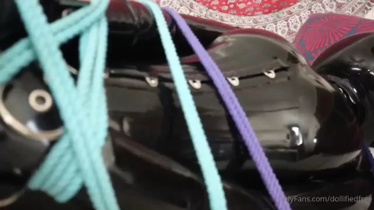 One horny latex-bound inflatable doll complete with rope chains and 