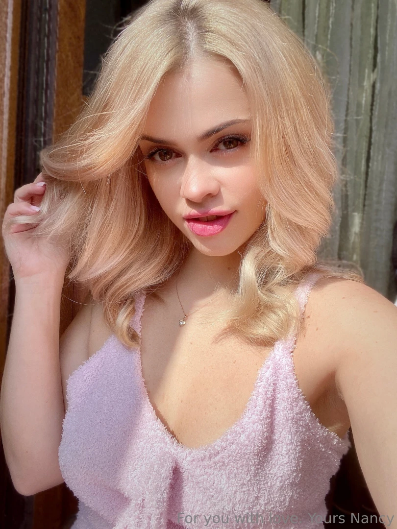 Do you like the combination of blond hair and pink shirt 