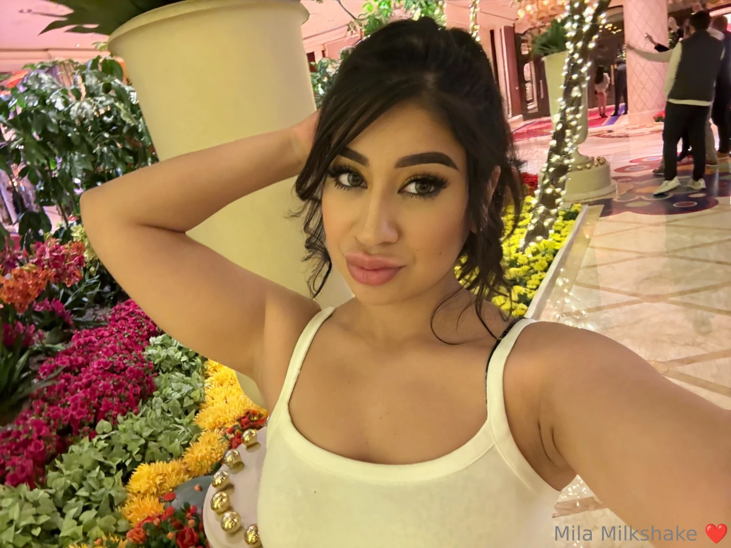 Surrounded by flowers but i think i d look better with you by my side 