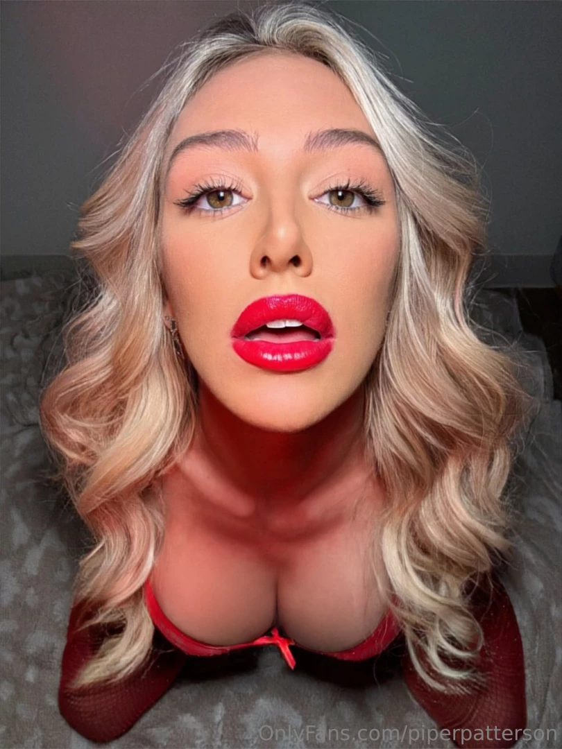 She takes pics with the cherry red lipstick 