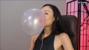 Small medium and big bubbles blown and sucked back in and the bubble