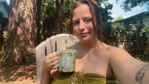 Topless in the back yard having coffee