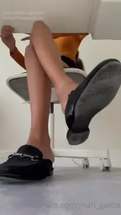 A shoe dangle beneath my desk while you kneel there watching obsessed 