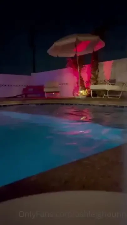 Just hanging out in the pool eating ice cream with no top on 