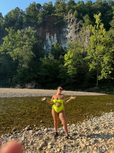 A river photo shoot and a skinny dip clip