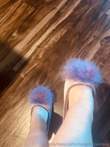 Got these sweet little purple fuzzy slippers from an admirer he often