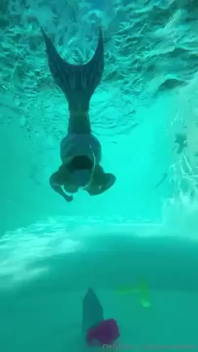 Mermaid playing with magic crystals 