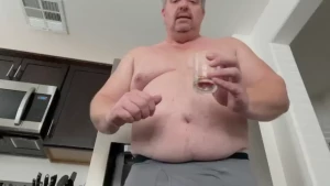 Giant eats tinies from the refrigerator