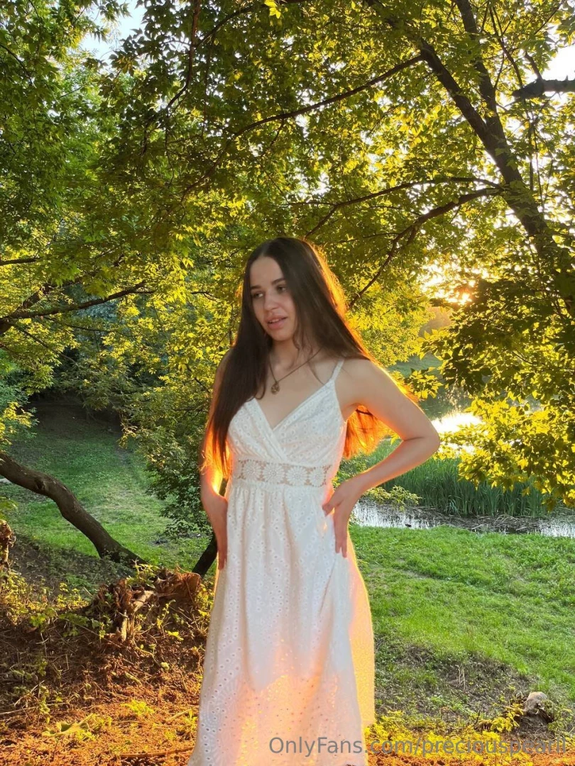 Loose hair white dress and such a scenery in the background have you 