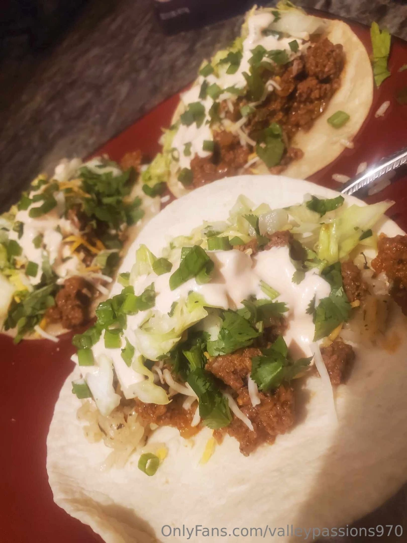 Some of the tastiest ground beef tacos with a cabbage slaw and red hot 