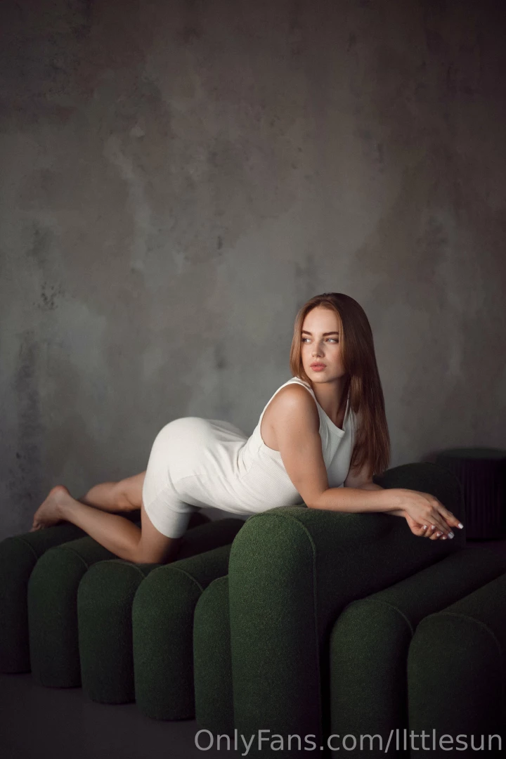 In this quiet moment as i lie in a white dress every movement feels 