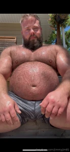 Big hairy dad mowing the lawn