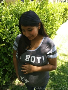 Youthful mommy with a pregnant bump woke up feeling a bit nostalgic