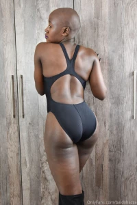 Tight fitting black yingfa swimsuit with a fresh bald shaved head part 2