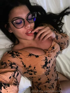 Lying on the bed with a playful finger near my lips sometimes a simple