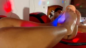 Up-close intimate foot action paired with deep intense pleasure this