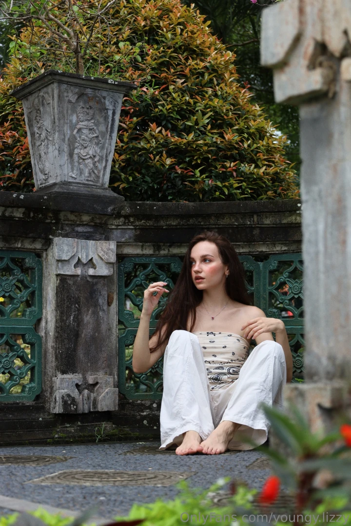 I saw a woman today placing flowers by a tree barefoot and peaceful no 