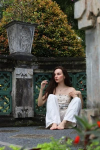 I saw a woman today placing flowers by a tree barefoot and peaceful no