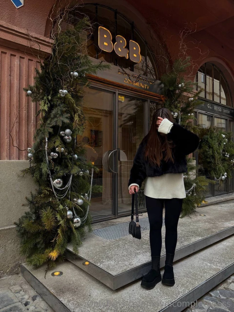 Cozy vibes in the city lights just me a white sweater and a little 