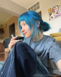 Evening vibes hair in a bun tracks in the background eating watermelon