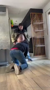 Giving him a few slaps so that he knows who s in charge spitting on