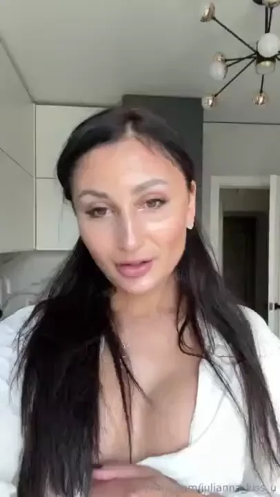 Under a light white robe large tense breasts await you demanding 