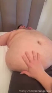 Grabbing that enormous belly