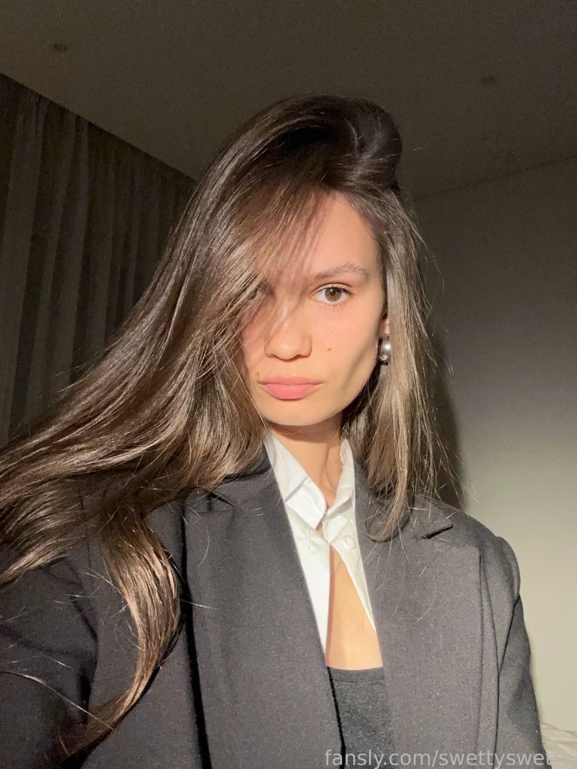 Sassy stare silky hair and a blazer that means business ready to take 