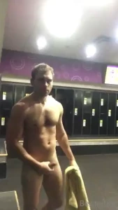 Just starting out at gym drying off after a shower in locker room