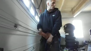 Horny mechanic with dirty hands jerks off in the shop shoots load on