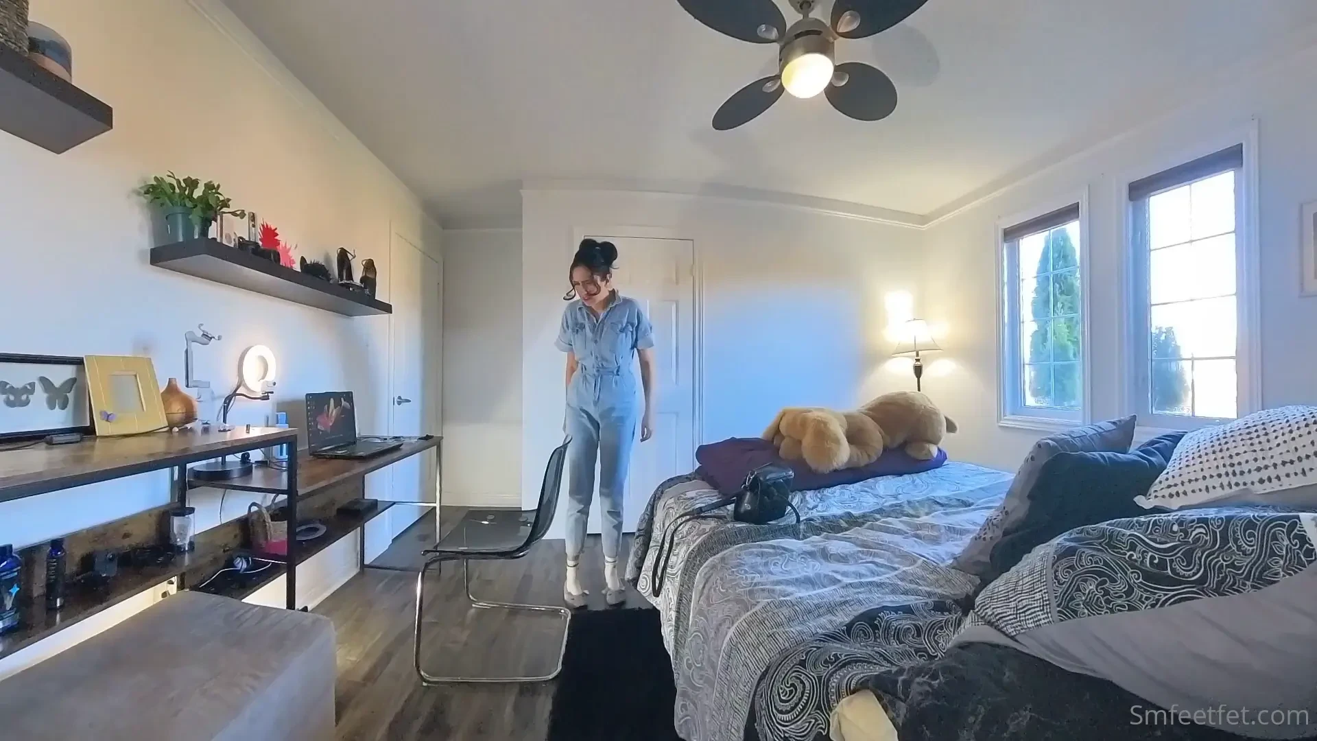 Stephanie comes home to relax at her desk and slide on her slippers 