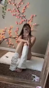 Naked except leg warmers