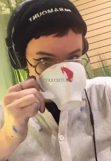 Dumb slut covered in paint drinking an espresso 