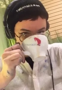 Dumb slut covered in paint drinking an espresso