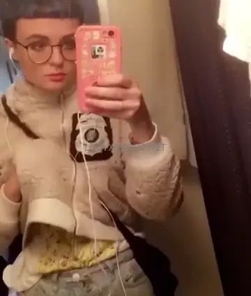 Blue hair and a puffy white punk jacket 