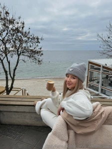 The sea breeze chills my skin my fingers hide around the warm cup of