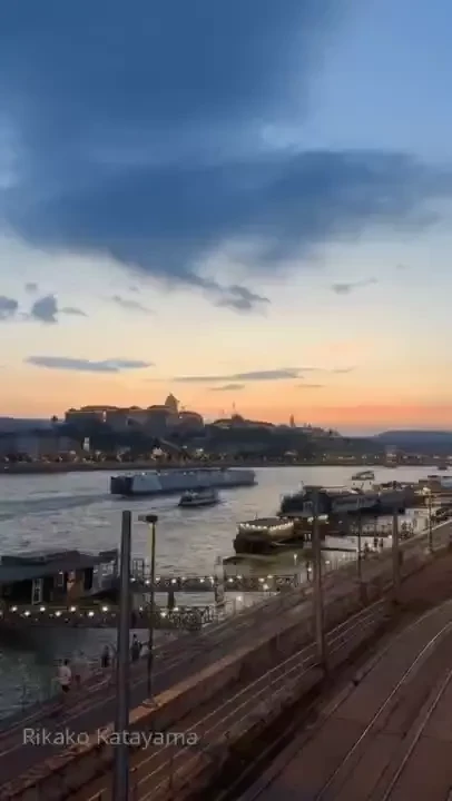 As i walked along the riverbank the setting sun cast a golden glow 