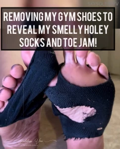 Removing my gym shoes to reveal my smelly holey socks and toe jam