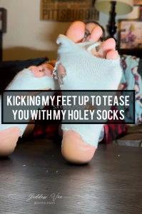 Kicking my feet up to tease you with my holey socks these old ratty