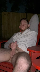 Watch me secretly stroke my cock outside while my neighbours are in